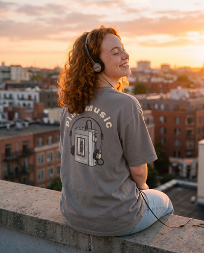 Play Music oversized tee back print worn on a rooftop at sunset