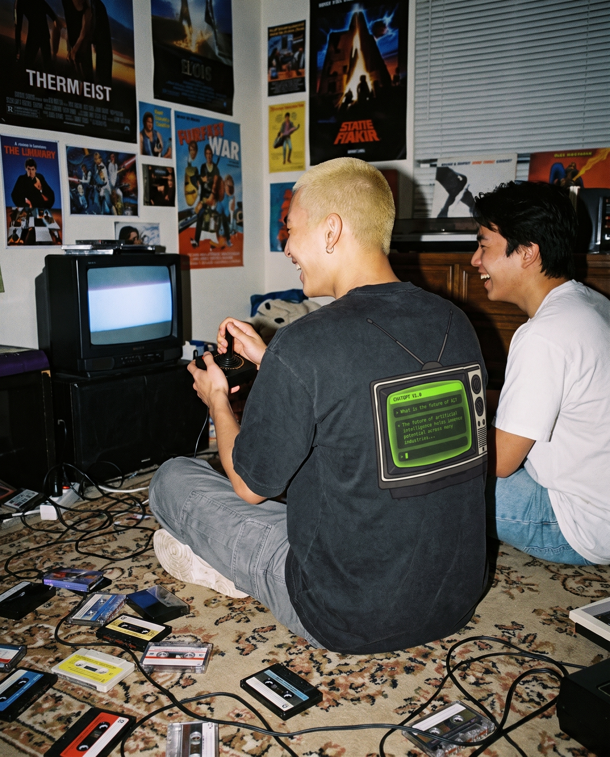 Old TV oversized tee back print worn in a 1980s bedroom lit by a CRT TV, vintage film photo