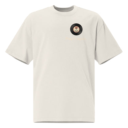 Play It Again oversized faded tee in bone, front view with retro cassette tape graphic